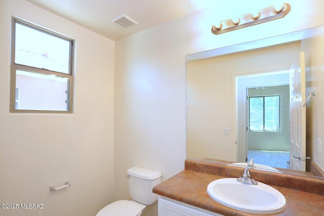 8573 N Western Juniper Ter, Tucson, AZ 85743 - bathroom with vanity, toilet, and visible vents
