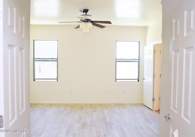 8573 N Western Juniper Ter, Tucson, AZ 85743 - interior space featuring light wood-style floors and baseboards