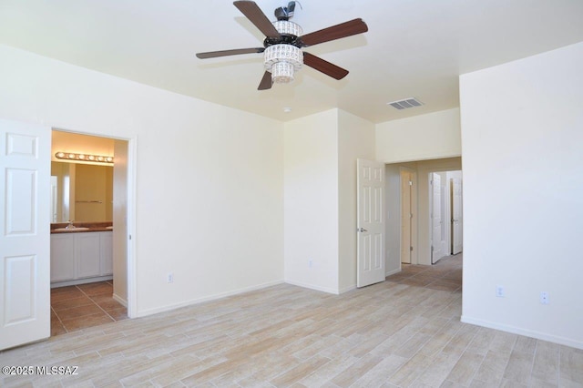 8573 N Western Juniper Ter, Tucson, AZ 85743 - unfurnished room featuring a ceiling fan, baseboards, visible vents, and light wood-type flooring