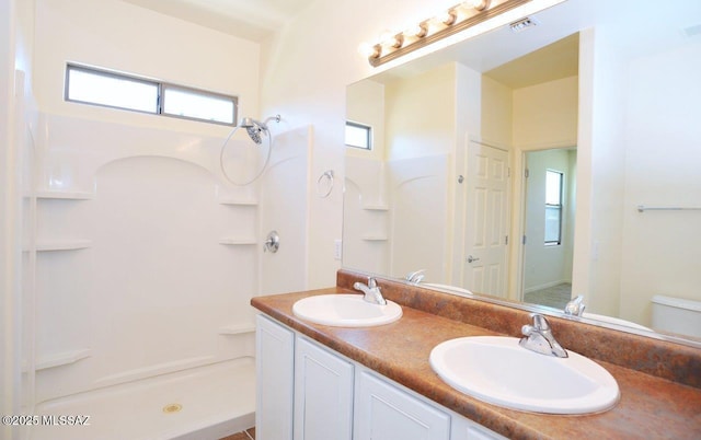 8573 N Western Juniper Ter, Tucson, AZ 85743 - full bath with a sink, double vanity, a shower, and visible vents