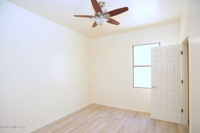 8573 N Western Juniper Ter, Tucson, AZ 85743 - empty room featuring light wood-style floors, baseboards, and ceiling fan
