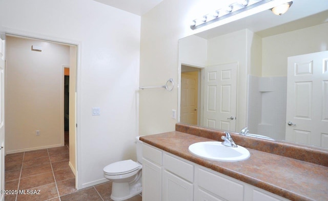 8573 N Western Juniper Ter, Tucson, AZ 85743 - bathroom featuring toilet, baseboards, tile patterned flooring, and vanity