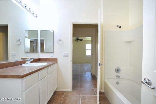 8573 N Western Juniper Ter, Tucson, AZ 85743 - full bathroom featuring a ceiling fan, bathtub / shower combination, vanity, tile patterned floors, and baseboards
