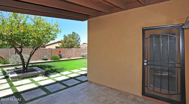 8573 N Western Juniper Ter, Tucson, AZ 85743 - property entrance featuring fence, stucco siding, and a patio area