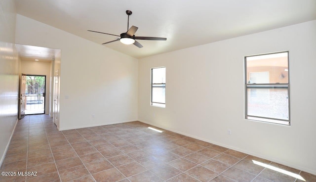 8573 N Western Juniper Ter, Tucson, AZ 85743 - empty room featuring baseboards, ceiling fan, vaulted ceiling, and tile patterned floors