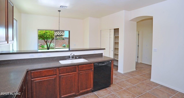 8573 N Western Juniper Ter, Tucson, AZ 85743 - kitchen with visible vents, dark countertops, arched walkways, a sink, and black dishwasher