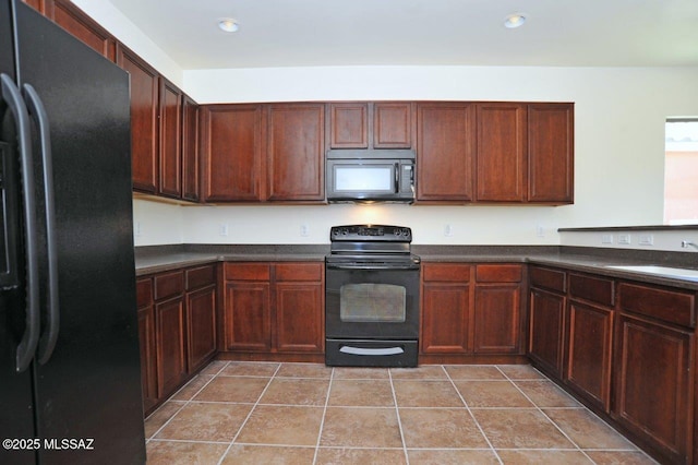 8573 N Western Juniper Ter, Tucson, AZ 85743 - kitchen with dark countertops, a sink, light tile patterned floors, black appliances, and recessed lighting