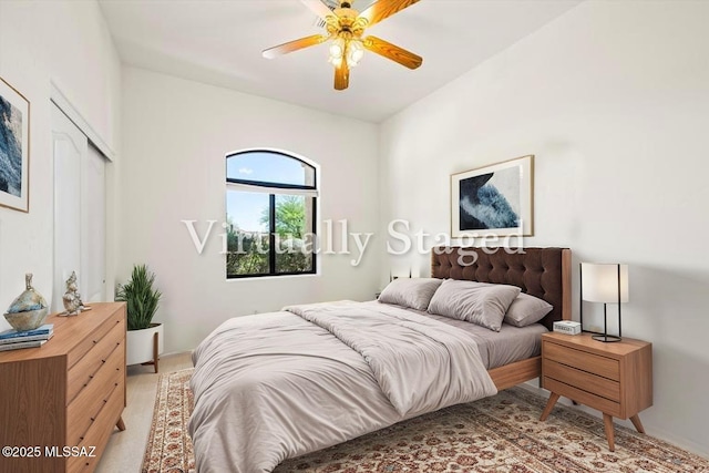 1040 W Stargazer Pl, Oro Valley, AZ 85737 - bedroom with baseboards, a closet, a ceiling fan, and light carpet