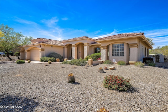 1040 W Stargazer Pl, Oro Valley, AZ 85737 - mediterranean / spanish-style house with stucco siding, a tile roof, and central AC