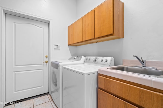 1040 W Stargazer Pl, Oro Valley, AZ 85737 - laundry area with cabinet space, washer and clothes dryer, and light tile patterned flooring