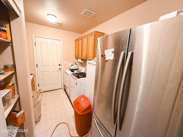 2692 W Dove Ln, Thatcher, AZ 85552 - laundry area with separate washer and dryer, light flooring, and a textured ceiling
