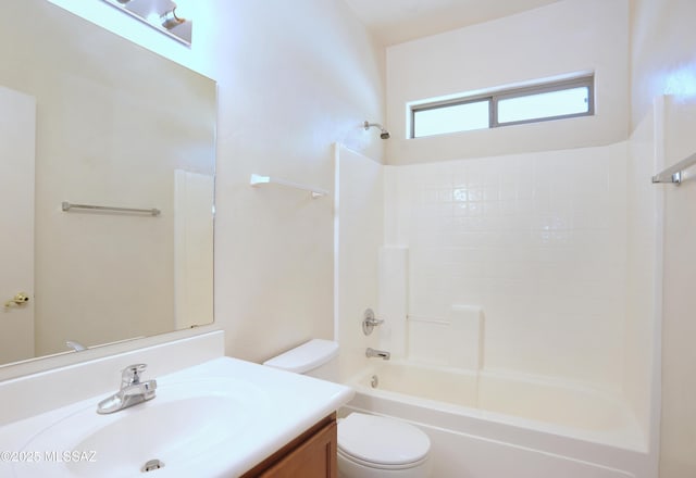 bathroom with toilet, washtub / shower combination, and vanity