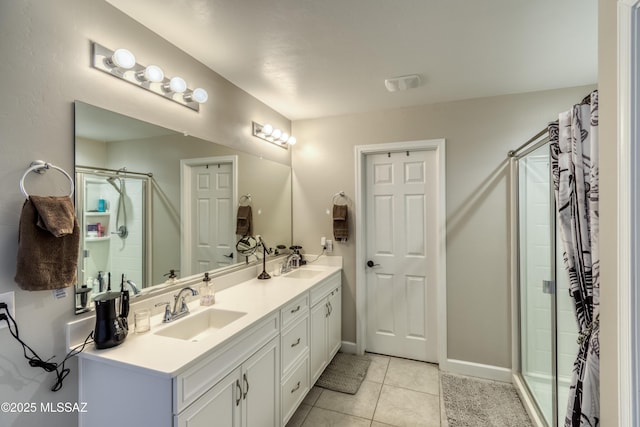 12100 E Ryscott Cir, Vail, AZ 85641 - bathroom featuring a sink, tile patterned flooring, a stall shower, and double vanity