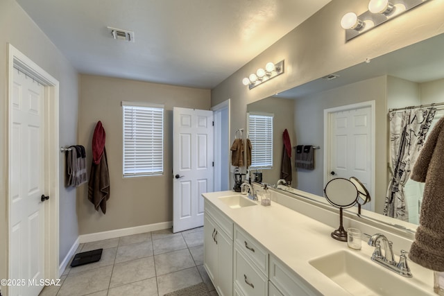 12100 E Ryscott Cir, Vail, AZ 85641 - bathroom featuring baseboards, visible vents, a sink, and tile patterned floors
