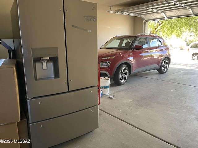 garage with stainless steel fridge