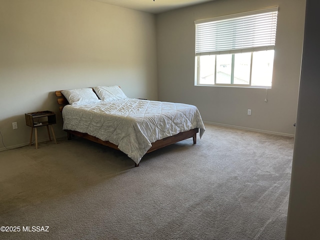 carpeted bedroom with baseboards