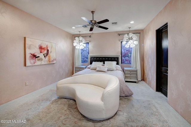 bedroom with recessed lighting, visible vents, carpet, and ceiling fan with notable chandelier