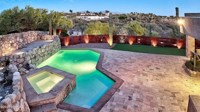 view of swimming pool with a yard and a fenced backyard