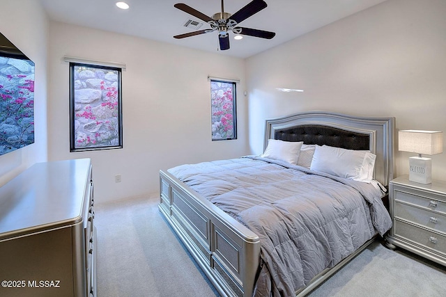 carpeted bedroom featuring visible vents, ceiling fan, and recessed lighting
