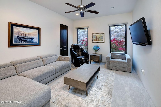 living area with light colored carpet, a ceiling fan, and recessed lighting