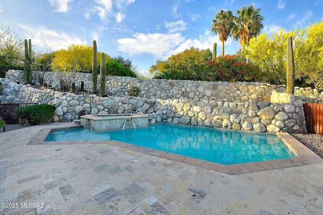 view of pool with a fenced in pool, an in ground hot tub, and a patio area