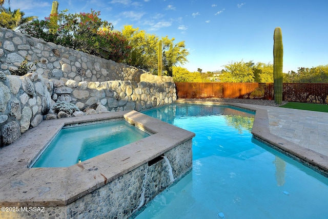 view of swimming pool featuring a fenced in pool, a patio area, an in ground hot tub, and a fenced backyard