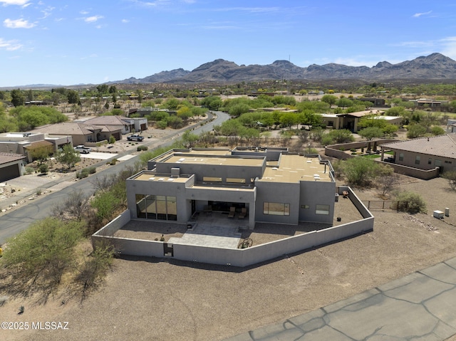 birds eye view of property with a residential view and a mountain view