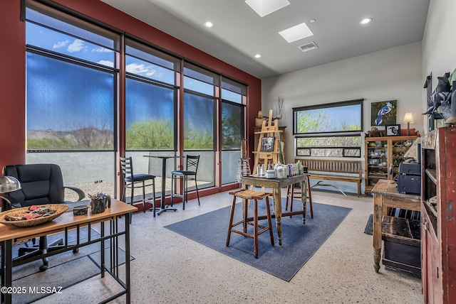 dining room featuring recessed lighting, a skylight, visible vents, and speckled floor