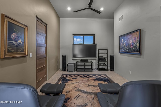 carpeted living area featuring ceiling fan, recessed lighting, and visible vents
