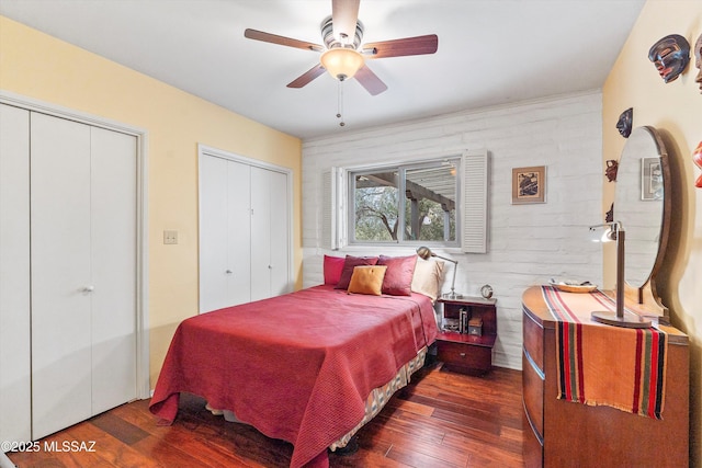 5920 N Campbell Ave, Tucson, AZ 85718 - bedroom with multiple closets, wood-type flooring, and ceiling fan