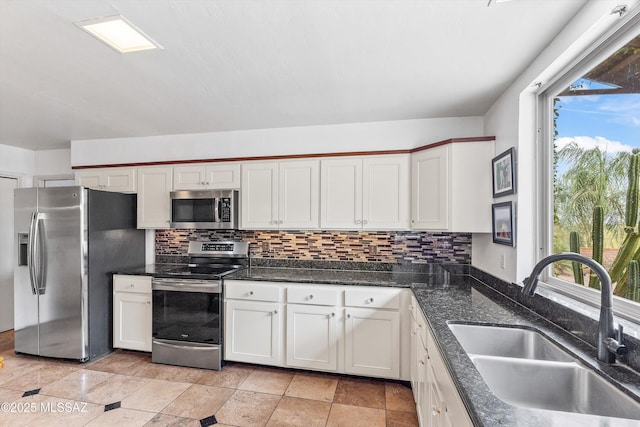 5920 N Campbell Ave, Tucson, AZ 85718 - kitchen featuring appliances with stainless steel finishes, a sink, plenty of natural light, and decorative backsplash