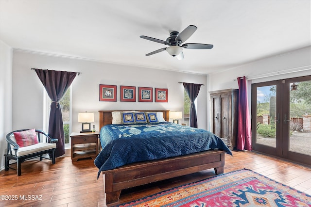 5920 N Campbell Ave, Tucson, AZ 85718 - bedroom featuring french doors, access to exterior, wood-type flooring, a ceiling fan, and crown molding