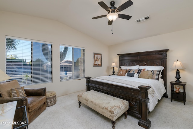 bedroom with light colored carpet, a ceiling fan, visible vents, and lofted ceiling