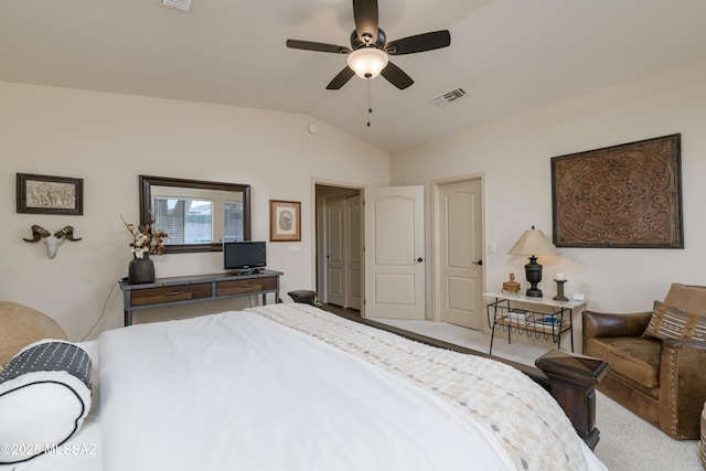 bedroom featuring visible vents, a ceiling fan, carpet floors, and lofted ceiling