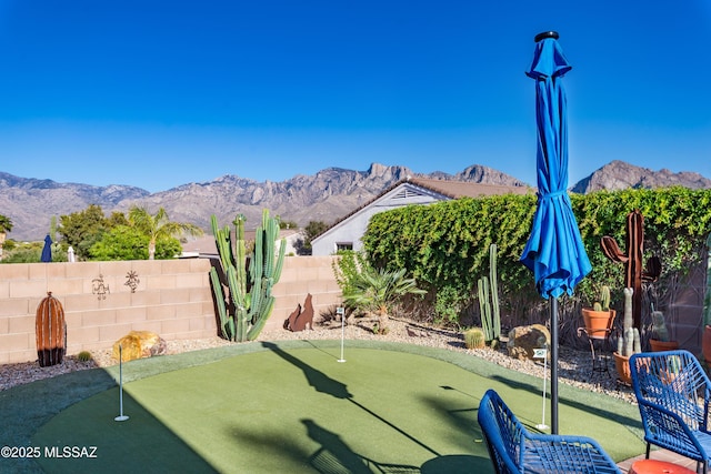 exterior space featuring a fenced backyard and a mountain view