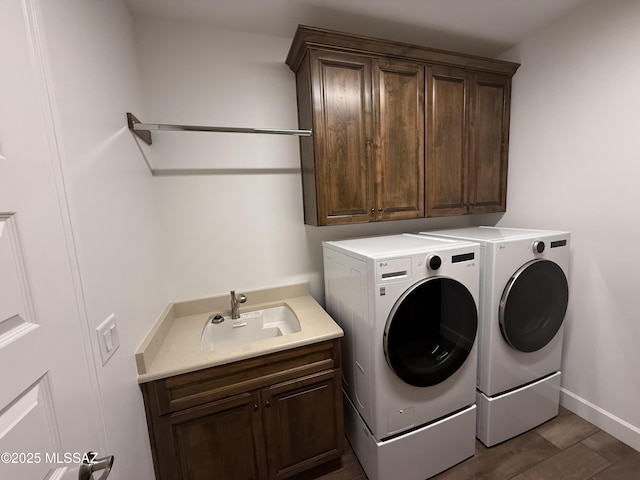 66414 E Peregrine Pl, Tucson, AZ 85739 - laundry area featuring cabinet space, separate washer and dryer, baseboards, and dark wood-type flooring