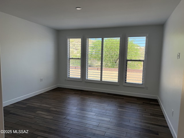 66414 E Peregrine Pl, Tucson, AZ 85739 - unfurnished room with dark wood-style flooring and baseboards