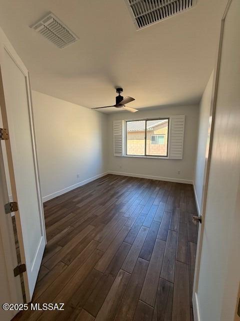 66414 E Peregrine Pl, Tucson, AZ 85739 - unfurnished room featuring dark wood-style floors, ceiling fan, and baseboards