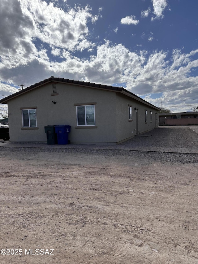 328 E 24th St, Tucson, AZ 85713 - view of side of property featuring stucco siding