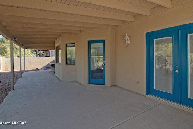 view of patio featuring fence