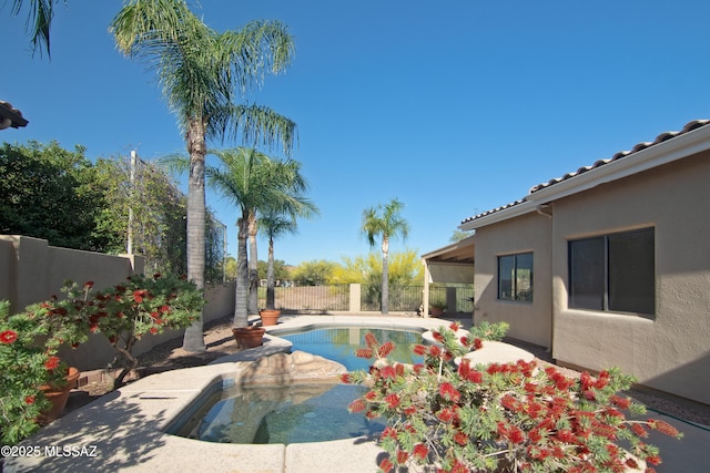 view of swimming pool with a fenced in pool and a fenced backyard