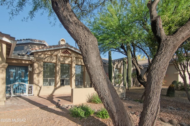 exterior space with stucco siding