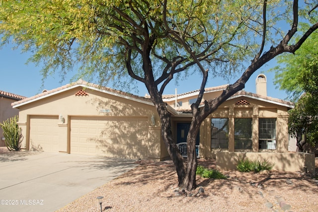 single story home with a tiled roof, driveway, a chimney, a garage, and stucco siding