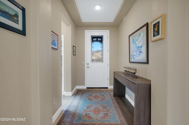 62911 E Thunder Rock Dr, Saddlebrooke, AZ 85739 - doorway to outside with wood finished floors and baseboards