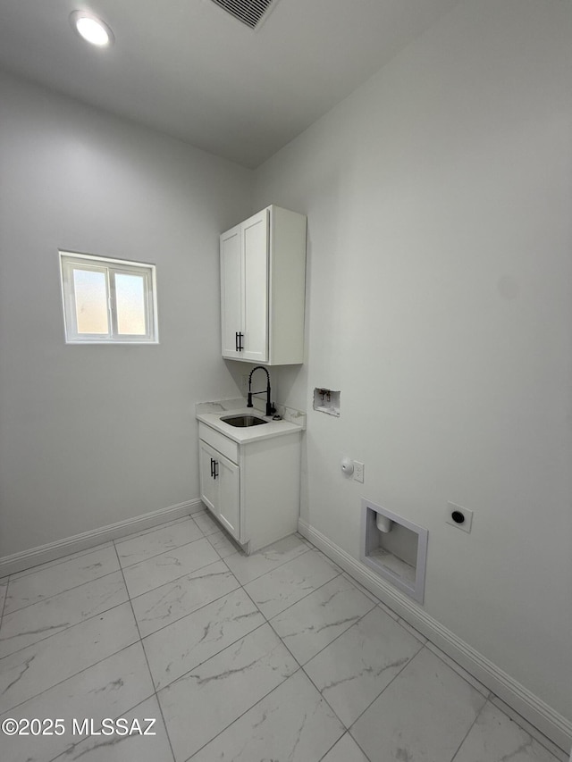 laundry room with hookup for an electric dryer, a sink, baseboards, cabinet space, and marble finish floor