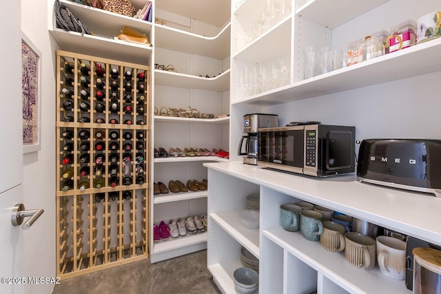wine room featuring concrete flooring