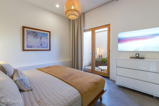 bedroom with recessed lighting, access to exterior, and finished concrete flooring