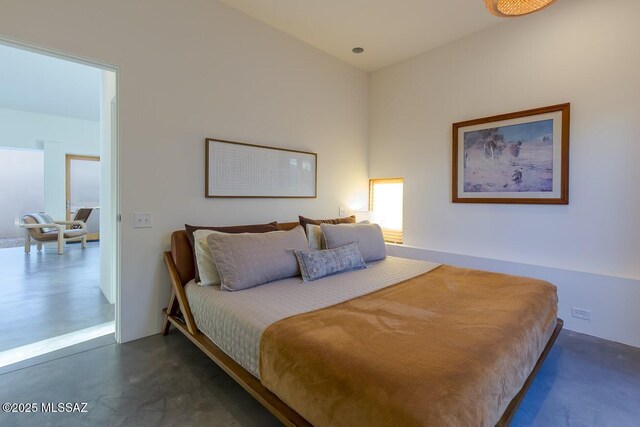 bedroom with concrete floors