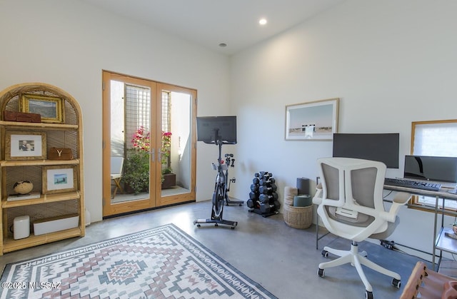 office featuring french doors, plenty of natural light, concrete flooring, and recessed lighting