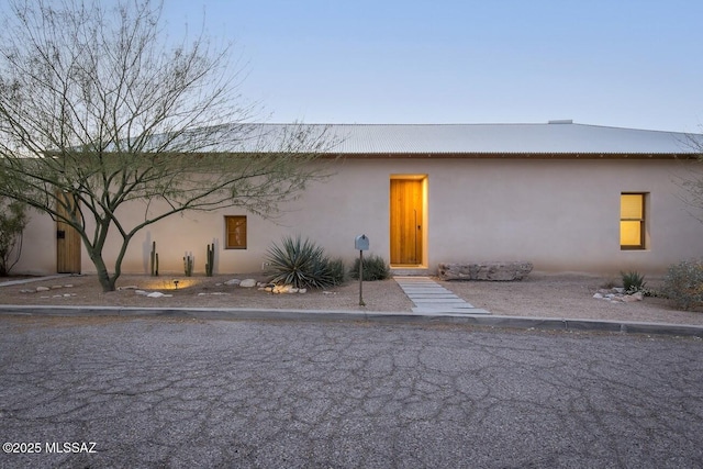 view of front of property featuring stucco siding